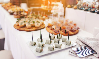 Luxury food and drinks on corporate party table.