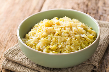 Fresh homemade braised white cabbage in bowl (Selective Focus, Focus one third into the cabbage)