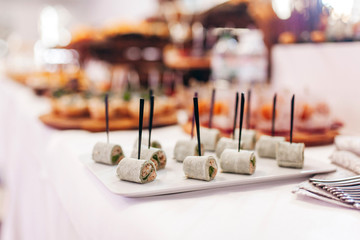 Luxury food and drinks on corporate party table.