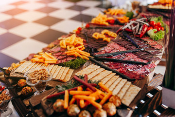 Luxury food and drinks on corporate party table.