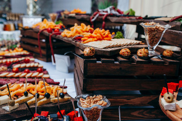Luxury food and drinks on corporate party table.