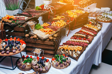 Luxury food and drinks on corporate party table.