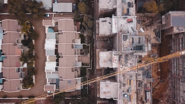 Close up of construction site of apartment building next to terraced houses, Pretoria, South Africa
