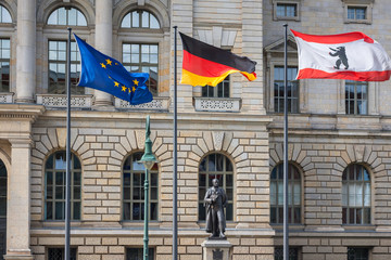 3 flags (Europe, Germany, Berlin) infront of Abgeordnetenhaus of Berlin, the state parliament for...