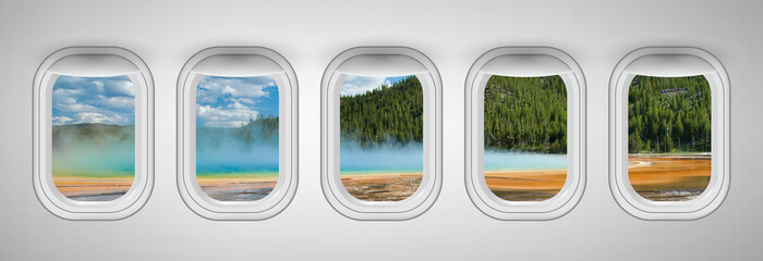 Airplane interior with window view of Yellowstone Prismatic Pool Concept of travel and air transportation