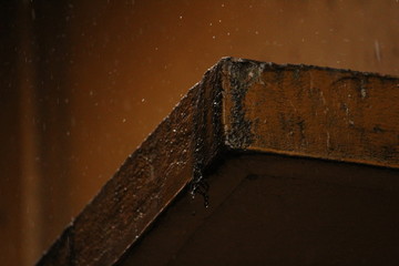 raining in the old dusted wall with some rain drops
