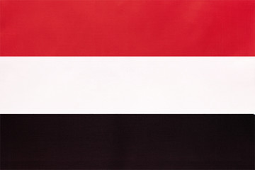 Yemen national fabric flag, textile background. Symbol of international asian world country