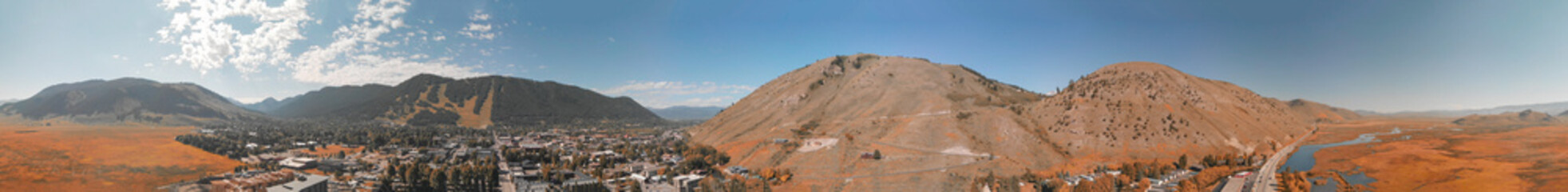 Obraz premium Jackson Hole, Wyoming. Panoramic aerial view of town and landscape on a beautiful summer morning.