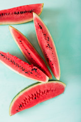 Slices of watermelon. Sliced watermelon on a turquoise background.