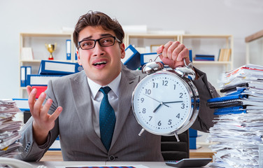 Businessman missing deadlines due to excessive work
