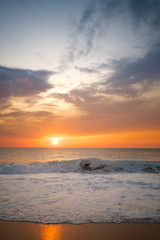 Obraz premium surfers at sunset