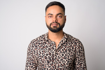 Obraz premium Face of young handsome bearded Indian man