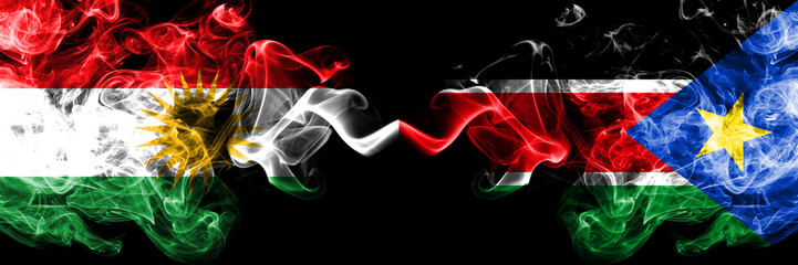 Kurdistan vs South Sudan smoke flags placed side by side. Thick colored silky smoke flags of Kurds...