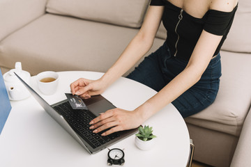 Fototapeta premium High angle woman checking black friday discounts