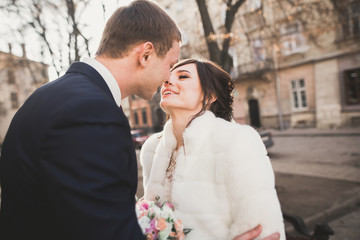 Wedding couple bride and groom holding hands