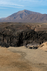 Del Pozo beach in Lanzarote, Canary Islands, Spain surrounded by rocks and cliffs