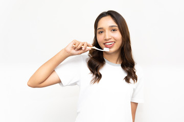 A beautiful Asian woman is brushing her teeth with a toothbrush, she is happy and a beautiful smile in the morning.