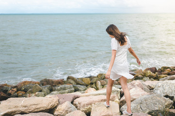 Asian women walking on the rock