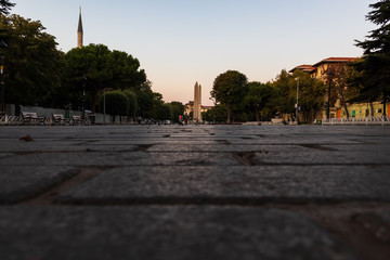 distant view of the obelisk in the downtown area of Istanbul near the most famous touristic attractions - Hagia Sophia Museum and the Blue Mosque earlu in the morning.