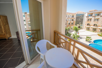 Terrace balcony with chairs in tropical luxury apartment resort