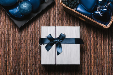 Christmas Background with women's hand wrapping Christmas Gift