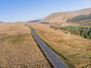 long road in wales through some emtpy moors on breacon