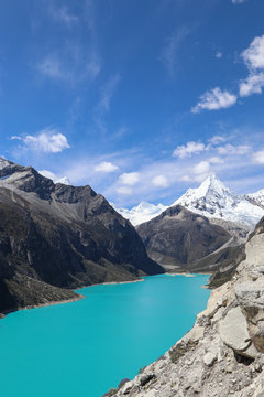 Peru - Hiking around Huaraz to laguna 69 and lake paron in the andes - turquoise blue lakes with snow capped mountains surrounding creating stunning scenery