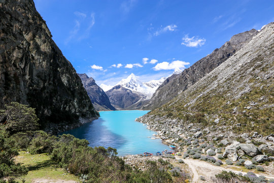 Peru - Hiking around Huaraz to laguna 69 and lake paron in the andes - turquoise blue lakes with snow capped mountains surrounding creating stunning scenery