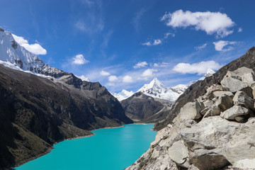 Obraz premium Peru - Hiking around Huaraz to laguna 69 and lake paron in the andes - turquoise blue lakes with snow capped mountains surrounding creating stunning scenery