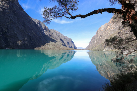 Peru - Hiking around Huaraz to laguna 69 and lake paron in the andes - turquoise blue lakes with snow capped mountains surrounding creating stunning scenery