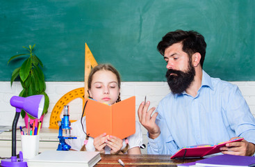 Naklejka premium Man bearded teacher excellent pedagogue. Pedagogue skills. Talented pedagogue. Work together to accomplish more. Explaining science to child. Fascinating lesson. School teacher and schoolgirl