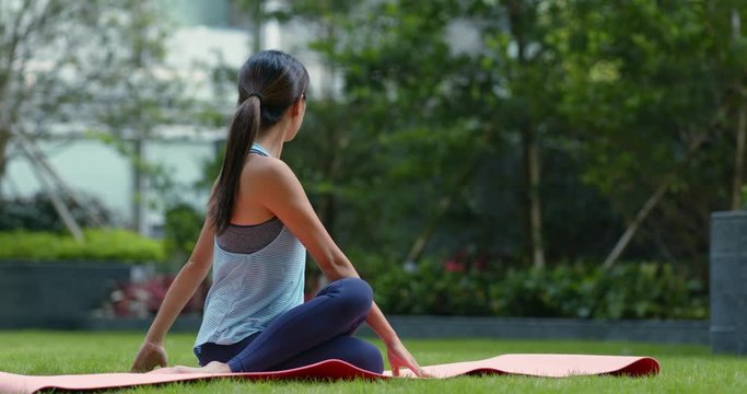 Woman do yoga at the park