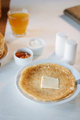 Butter and pancakes - russian national food on restaurant.