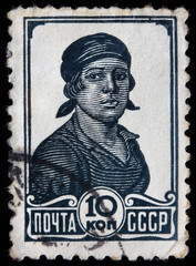 USSR - CIRCA 1936: A stamp printed in the USSR shows portrait of soviet female worker
