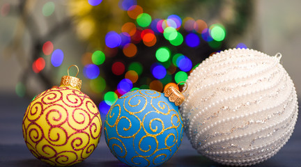 Fototapeta na wymiar Christmas balls decoration on blue wooden surface. Winter holiday concept. Symbol of new year and christmas holidays. Decorate christmas tree with traditional toys. Various christmas decorations