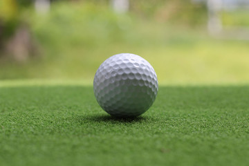 Golf equipment in beautiful golf course at sunset background.