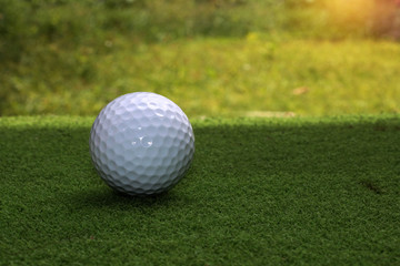 Golf equipment in beautiful golf course at sunset background.