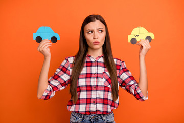 Cheap or expensive concept. Close up photo of unsatisfied unhappy pondering planning pensive woman...