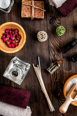 spa composition for body care with salt on wooden background top view