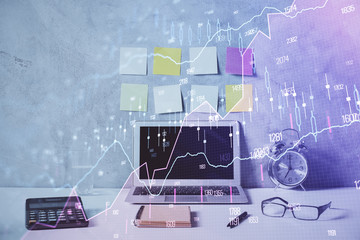 Double exposure of forex graph and work space with computer. Concept of international online trading.