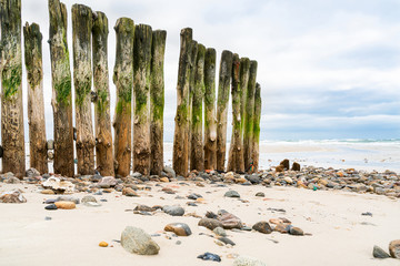 Wooden breakwater on the beach. North Sea. Sylt island.