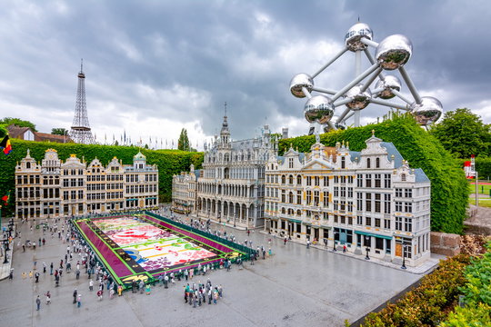 Grand place square in mini Europe park with Atomium (iron atom model) at background, Brussels, Belgium
