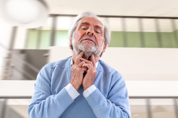 Fototapeta premium Sore throat man. Adult, senior.