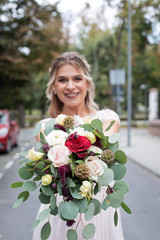 Fototapeta premium Colourful bouquet and bride