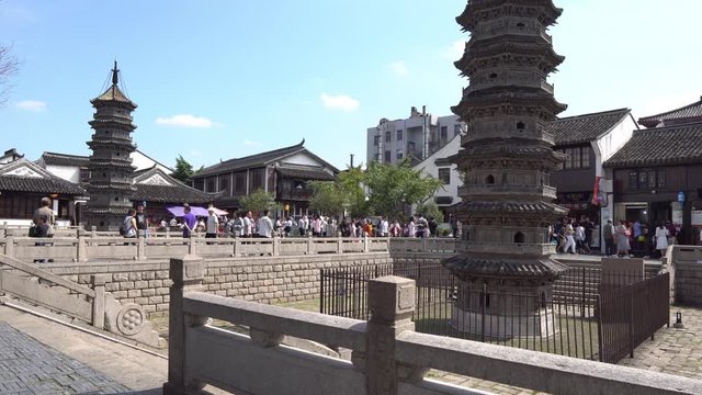 Shanghai Nanxiang Old Town Canal City Picturesque Stone Pagoda with Walking People on a Sunny Blue Sky Day