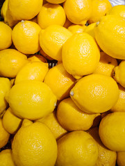 Ripe lemon in the market. Harvest concept, organic food, fruits. An abundance of fruit...