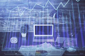 Double exposure of graph and financial info and work space with computer background. Concept of international online trading.