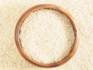 Rice in bowl. Background from basmati rice. Indian cuisine ingredients