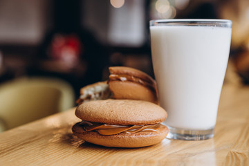 Close up Traditional chocolate and Pumpkin Whoopie pies filled made with vanilla cream cheese frosting cream
