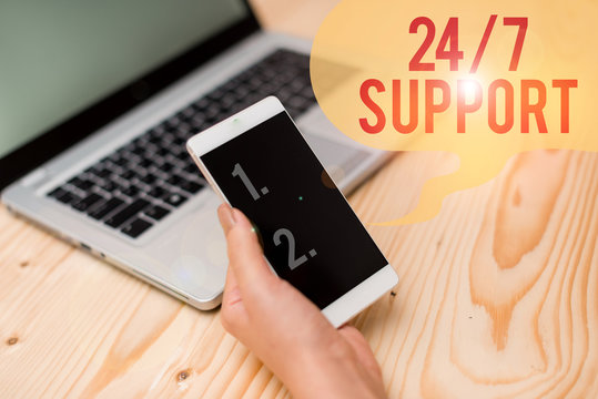 Word writing text 24 Or 7 Support. Business photo showcasing Giving assistance to service whole day and night No downtime woman laptop computer smartphone mug office supplies technological devices